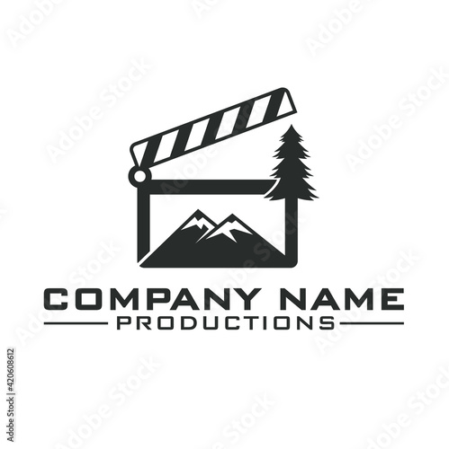 illustration of clapper board, pine and mountain.