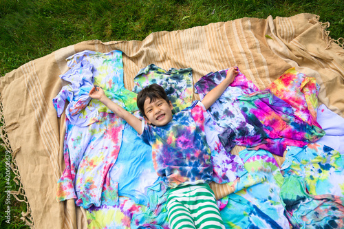 Happy kid with tie-dye shirts