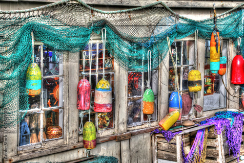 Old building, Netarts, Oregon. Decorated with colorful fishing gear. photo