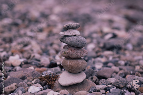 Made of stone tower on the beach and blur background 