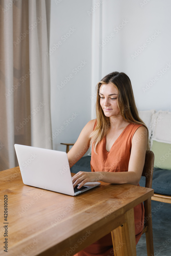 Female freelancer using netbook at home Female freelancer using netbook at home