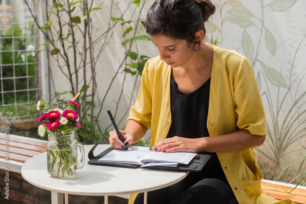 Brunette Businesswoman Writing In The Notebook Brunette Businesswoman Writing In The Notebook