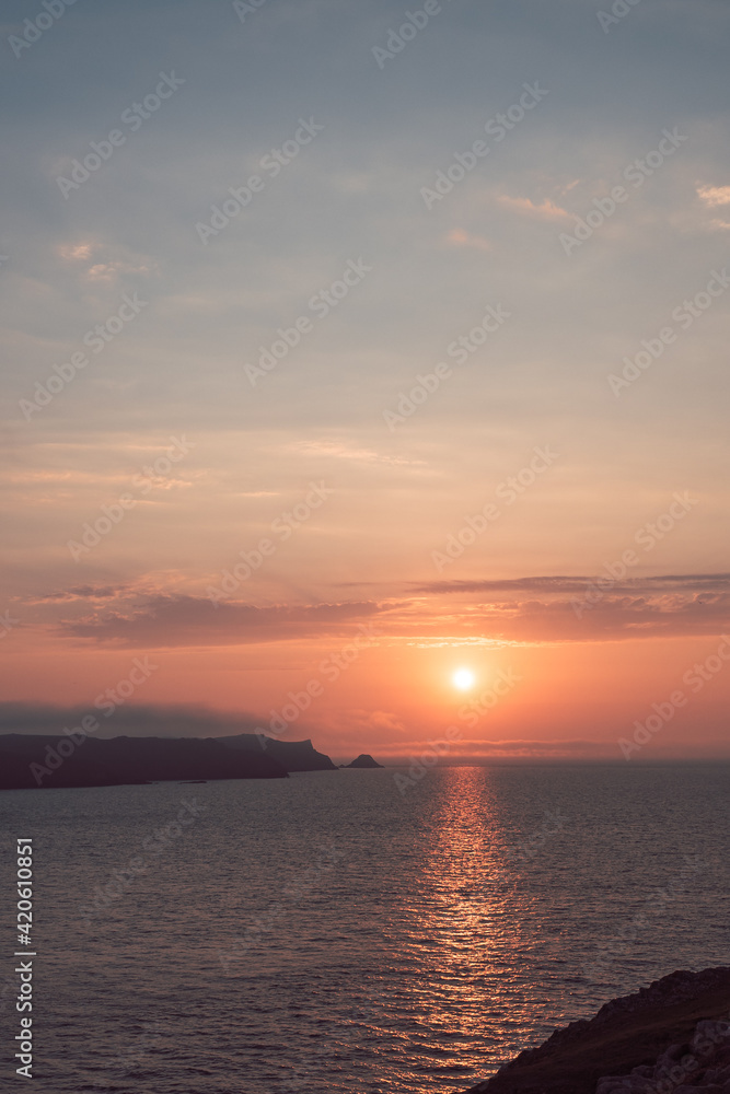 Sunset over the Island of Skomer in West Wales Sunset over the Island of Skomer in West Wales