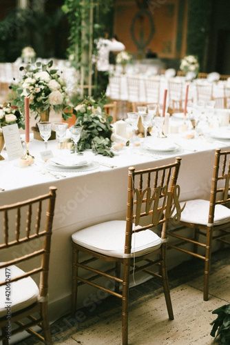Italian table setting with MRS sign on a golden chair