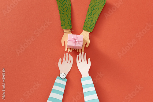 Male gives a gift present to female with color background. happiness moment concepts ideas