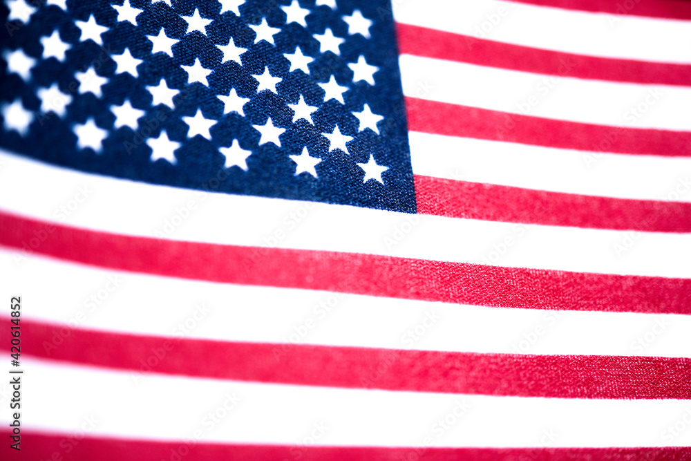Fototapeta premium Macro Shot Of Handheld American Flag On Coarse Fabric