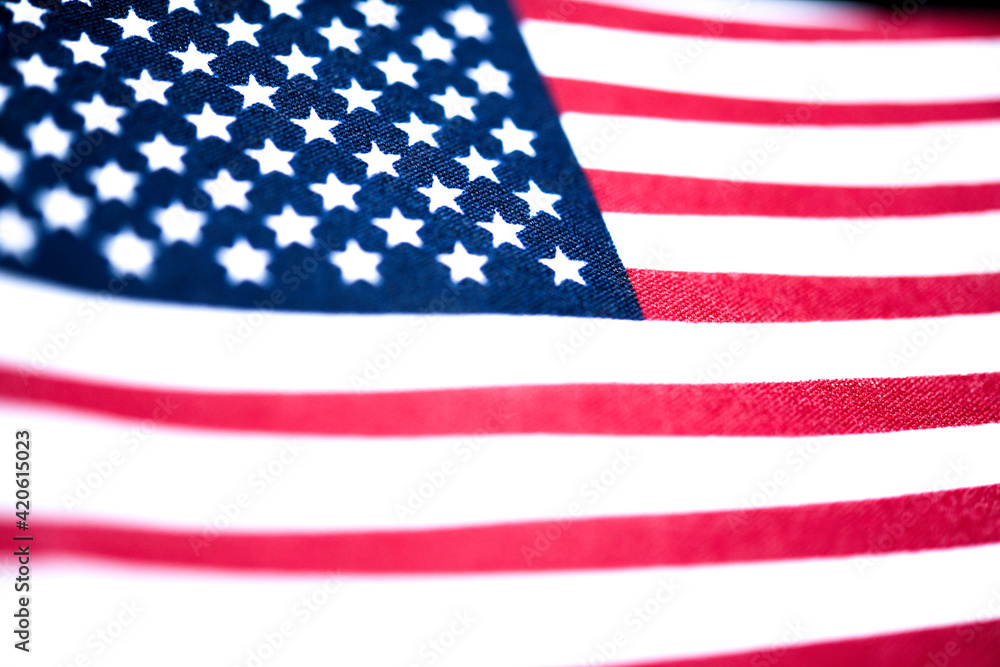Fototapeta premium Macro Shot Of Handheld American Flag On Coarse Fabric