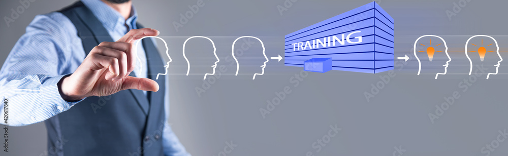 Fototapeta premium man holding heads with TRAINING icon