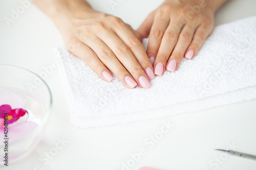 Woman making manicure when resting at home