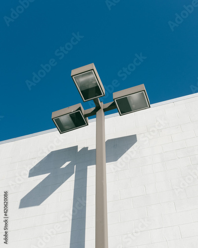 light pole against blue sky photo