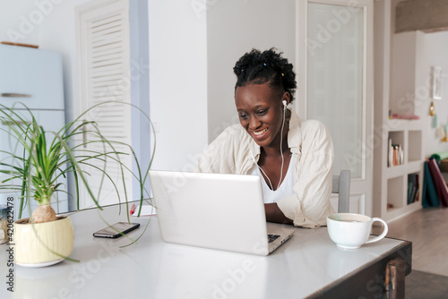 Young woman at her home office photo