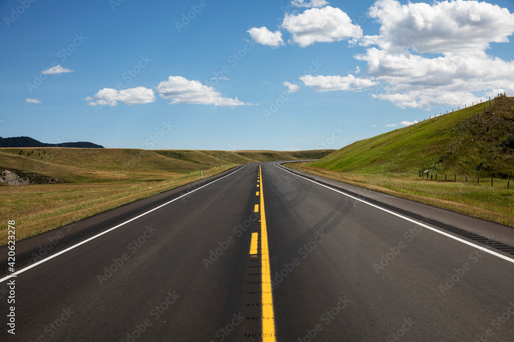 A paved highway through the prairies. A paved highway through the prairies.