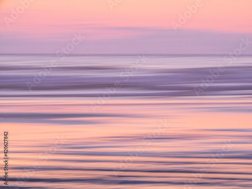 Fototapeta Naklejka Na Ścianę i Meble -  USA, Oregon, Cannon Beach and a dreamy view of the beach at low tide at sunset
