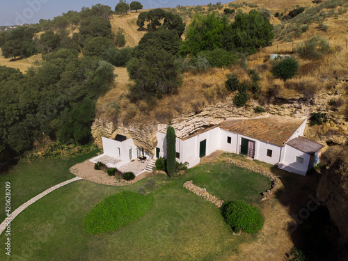 Exterior of residential house built into rock