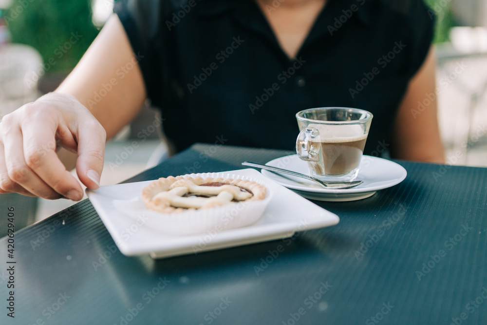 Drinking coffee and eating pastries Drinking coffee and eating pastries