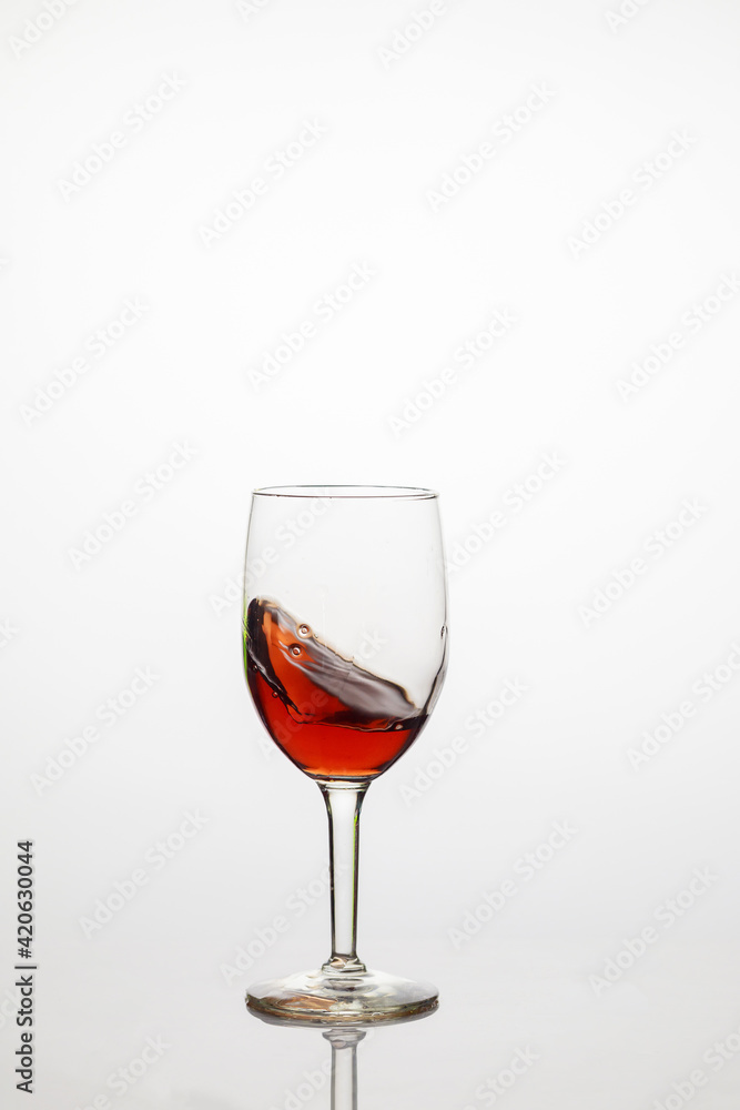 Wine transparent glass with red grape wine. Wine transparent glass with red grape wine.