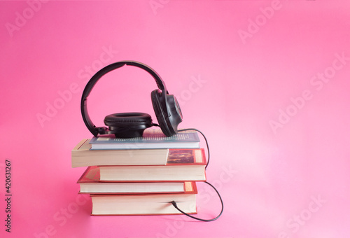 book and headphones. concept of audiobooks and education book, earphone, information, learning, library, listen, literature, reading, school, studying, textbook, education, music, sound, audio, techno