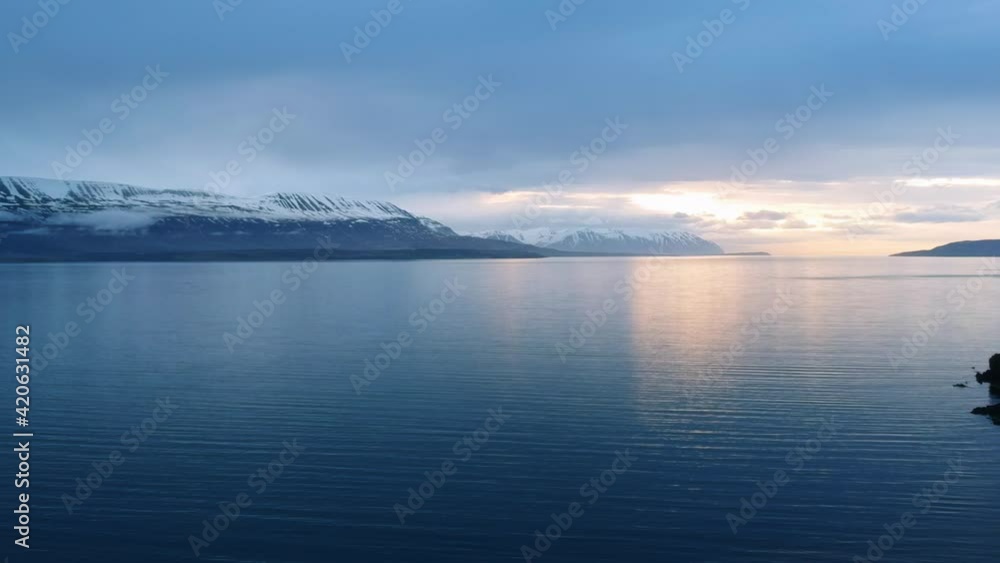 Aerial pan of a beautiful sunset in Sveinbjarnargerdi Fjord in Iceland during spring. Aerial pan of a beautiful sunset in Sveinbjarnargerdi Fjord in Iceland during spring.