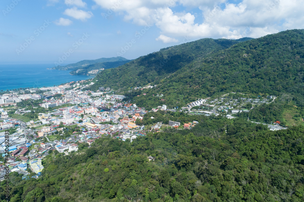 Amazing Landscape nature view from Drone camera High angle view of patong bay with mountain range in the foreground.Patong city in phuket thailand