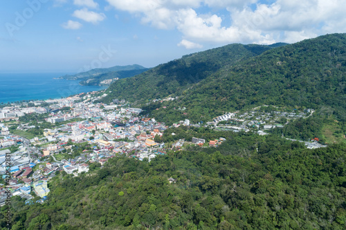 Amazing Landscape nature view from Drone camera High angle view of patong bay with mountain range in the foreground.Patong city in phuket thailand