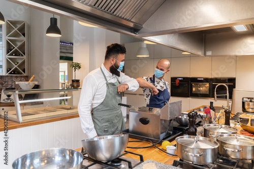 Elbow Bump Between Chefs