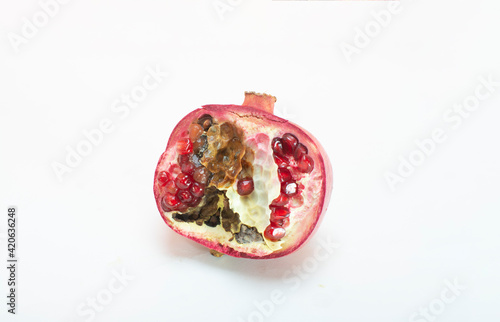 Rotten rotten pomegranate fruits. Top view. on white background
