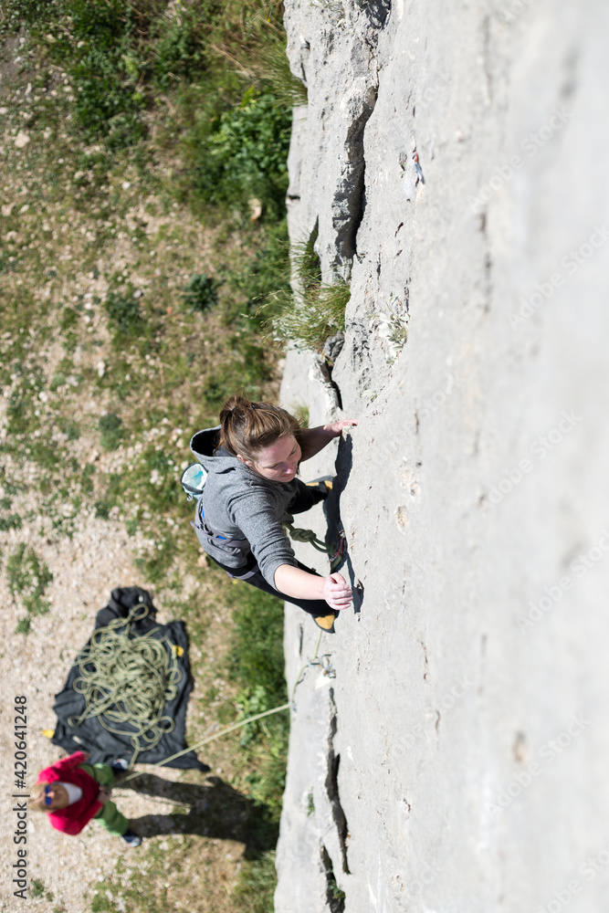 Adventurous Woman Rock Climbing Outdoors Adventurous Woman Rock Climbing Outdoors