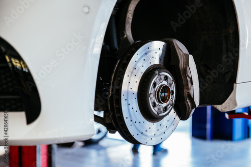 Brake disc of car in garage photo