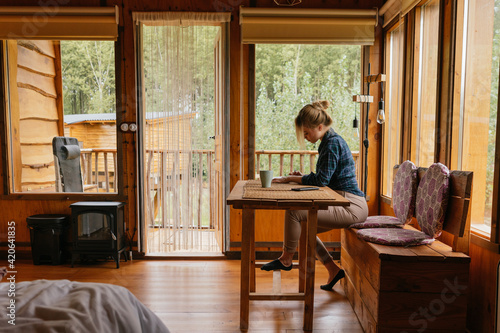 Woman in a cabin lodge photo