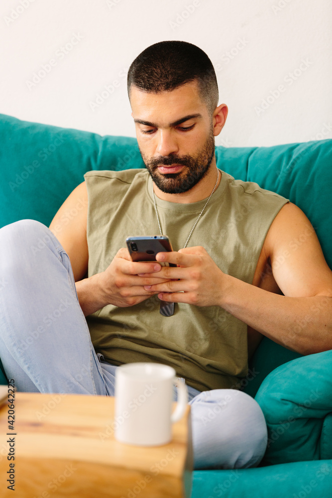 Young man using mobile phone Young man using mobile phone