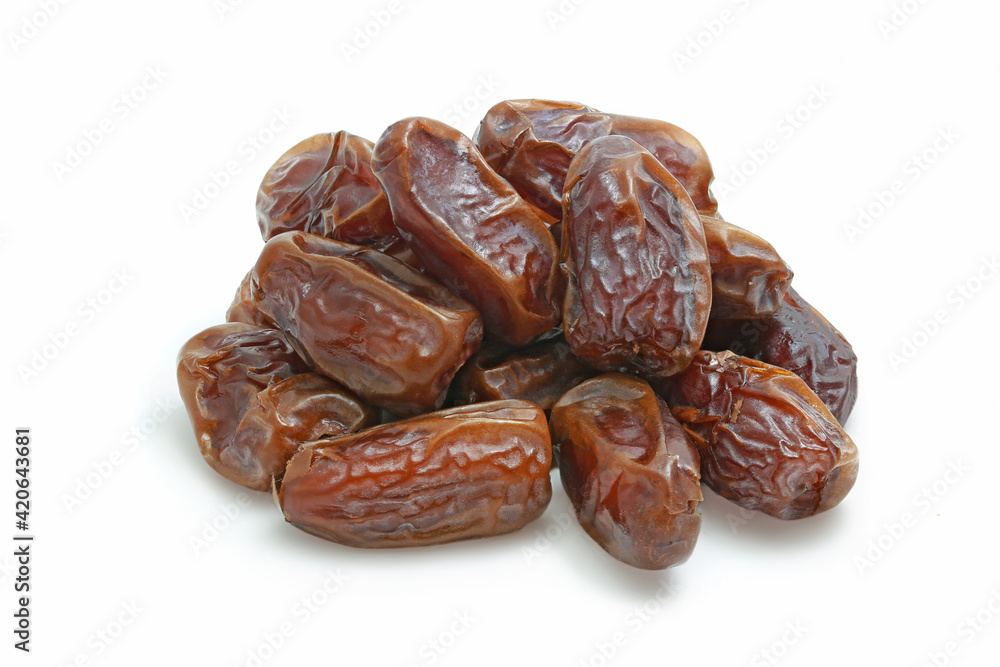 Heap of dried tasty dates with half isolated on white Heap of dried tasty dates with half isolated on white