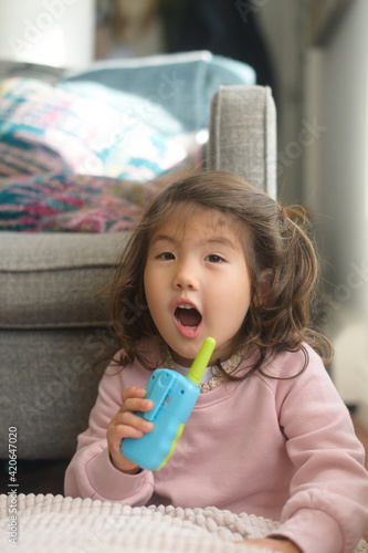 Kid playing with walkie talkie