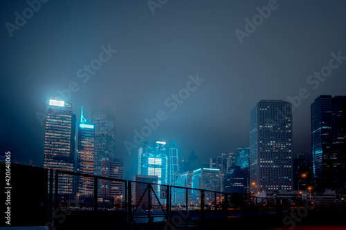 Modern office buildings in Hong Kong at foggy night