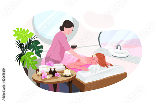 Relaxed woman getting back massage in luxury spa with professional massage therapist. Wellness, healing and relaxation concept.
