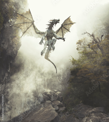 Dragon flying up out of cavern in misty fantasy forest photo