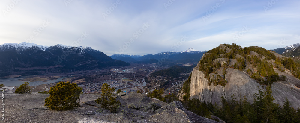 Panoramic View of Beautiful Canadian Landscape and Squamish City during a sunny sunset. Taken from Chief Mountain, near Vancouver, British Columbia, Canada.