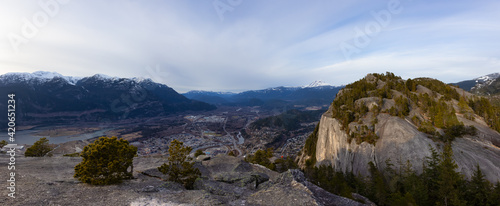 Panoramic View of Beautiful Canadian Landscape and Squamish City during a sunny sunset. Taken from Chief Mountain, near Vancouver, British Columbia, Canada.
