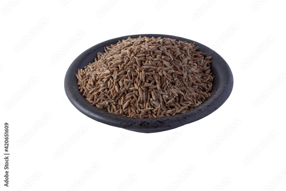Black cumin in the cup on a white background Black cumin in the cup on a white background