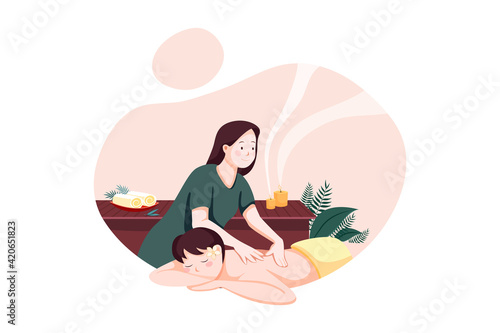 Relaxed woman getting back massage in luxury spa with professional massage therapist. Wellness, healing and relaxation concept.