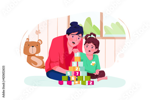 Babysitter and baby girl playing with toy cubes at home