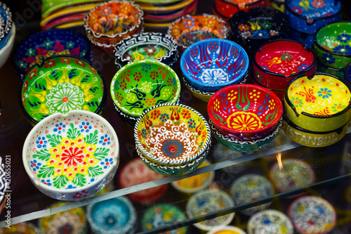 Colorful painted ceramics for sale on showcase of Istanbul bazaar. Traditional Turkish souvenirs © JackF