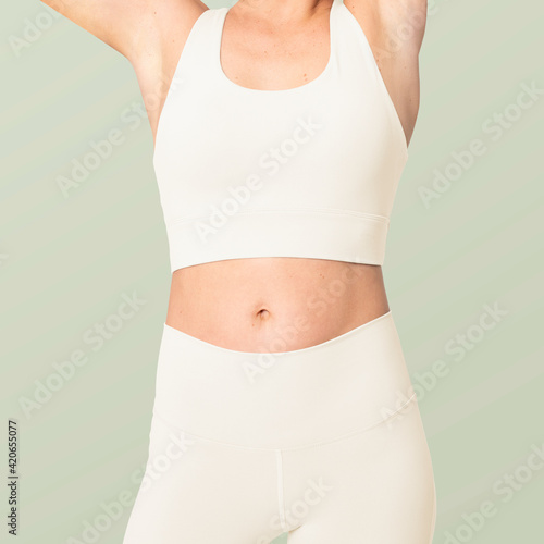 Sporty woman in white sportswear fashion shoot