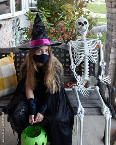 Sad Halloween Girl Wearing Face Mask photo