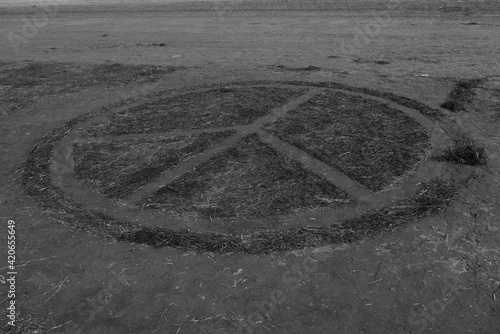 A peace sigh on a sand photo