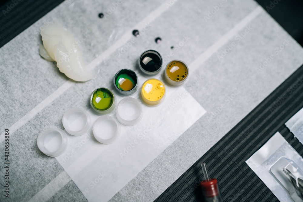 Palette with different inks in tattoo studio Stockfoto Adobe Stock