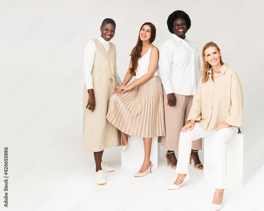 Diverse group of people wearing earth tone casual outfit for apparel ad Diverse group of people wearing earth tone casual outfit for apparel ad