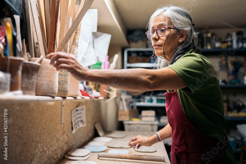 Woman Working in Pottery Workshop photo