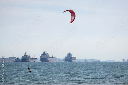 A. kite surfer in Singapores harbour photo