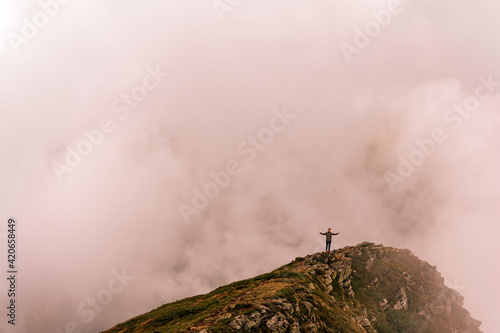 Time after the rain on the top of Gutyn Tomnatyk mountain, mystical fog and white clouds in the mountains, the beauty of the Montenegrin ridge. photo