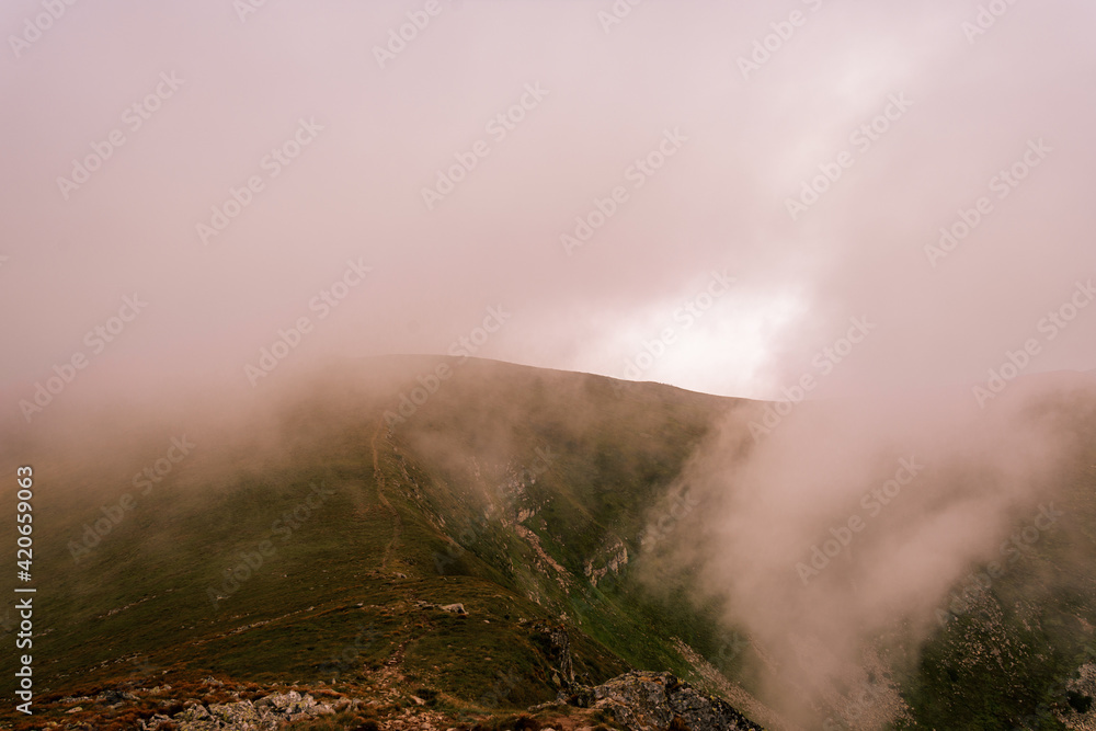 Magical overcast landscape of the Montenegrin ridge in the Carpathians, picturesque landscapes from Gutin Tomnatych, the Carpathians after the summer morning rain. Magical overcast landscape of the Montenegrin ridge in the Carpathians, picturesque landscapes from Gutin Tomnatych, the Carpathians after the summer morning rain.